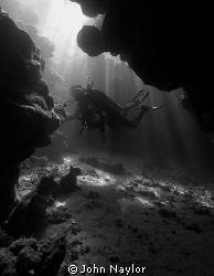diver in cave by John Naylor 